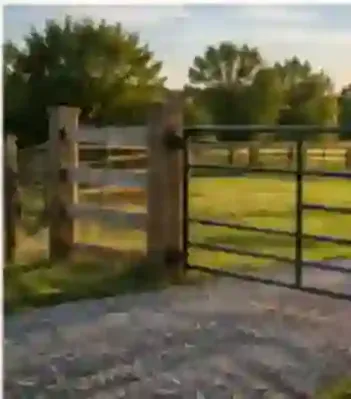 Wood and metal ranch entrance gate installed on a rural property near Burley